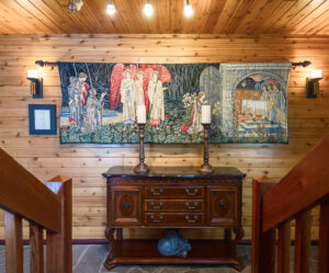 Wall scroll of angels vising a household