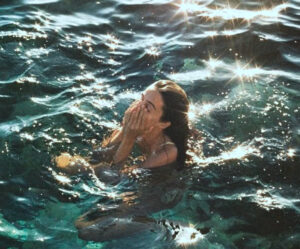 Woman swimming in lake