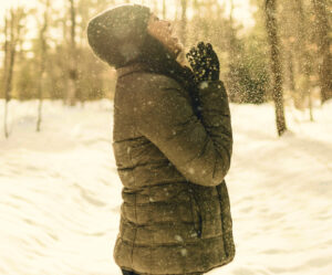 Woman enjoying a snowfall