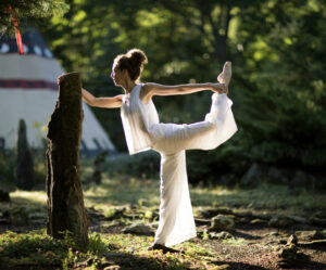 Woman doing yoga in a outdoor space