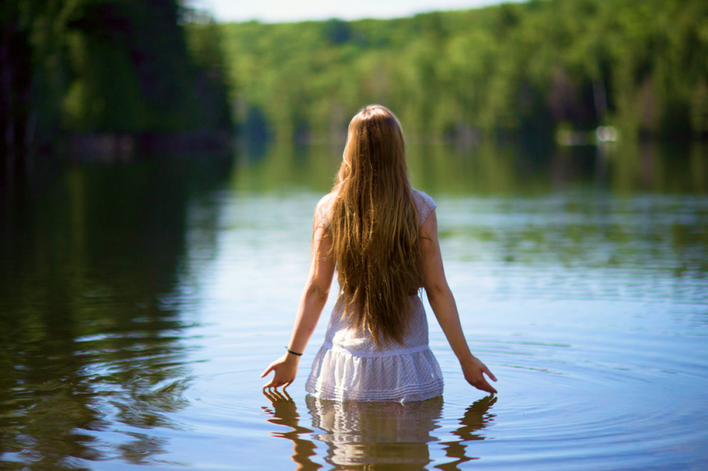Woman standing in a lake