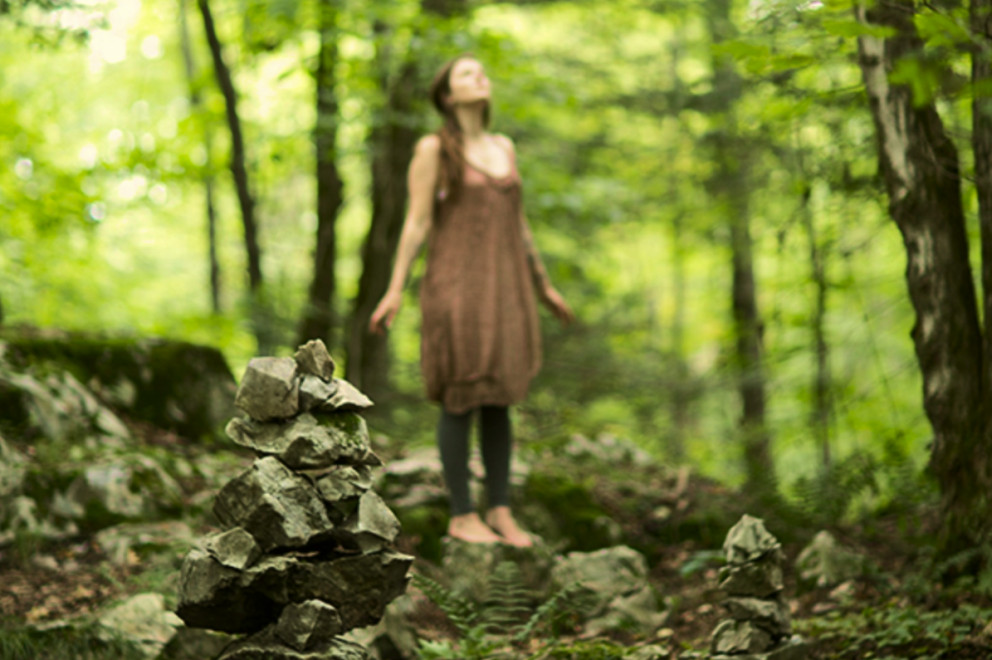 Woman standing in a forest