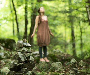 Woman standing in a forest