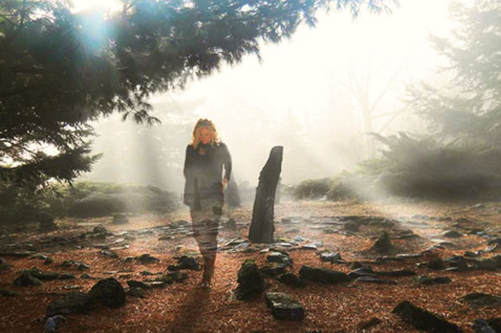 Outdoor display of nature with woman standing inside