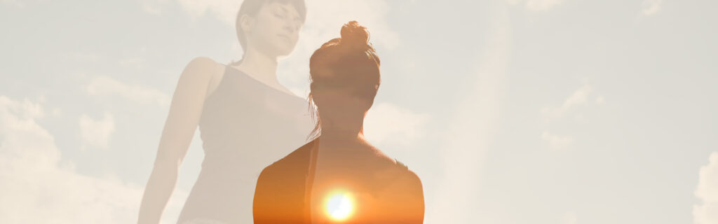 Woman meditation with sky behind her