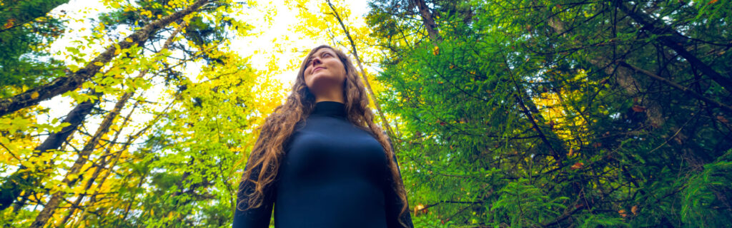 Woman standing in a forest