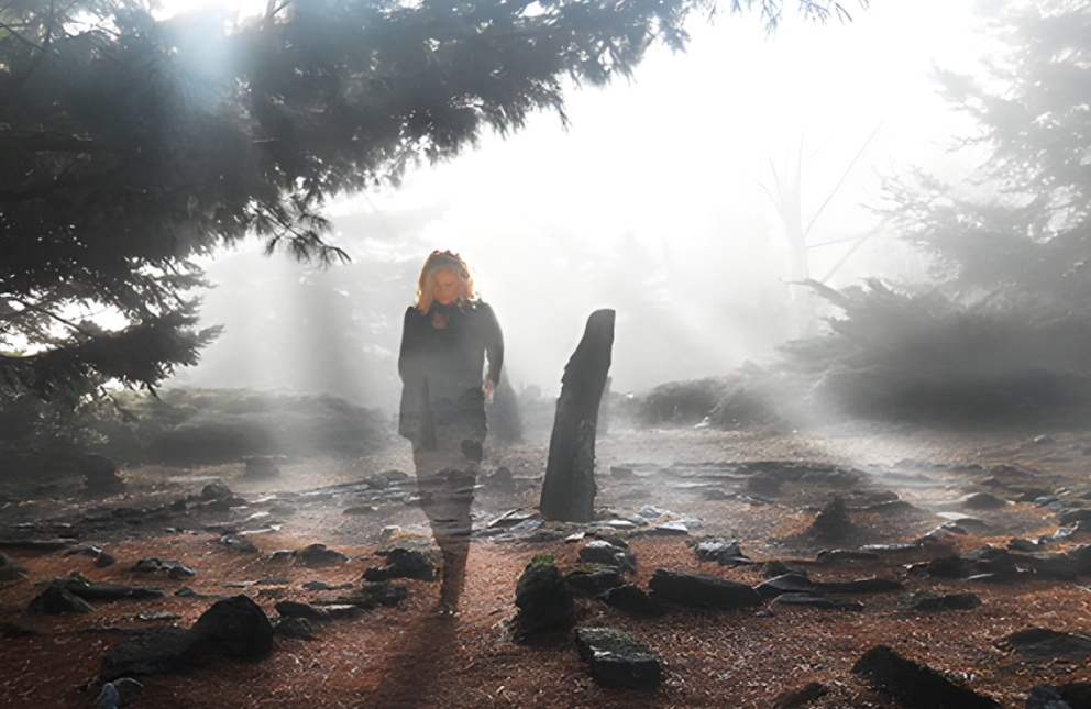 Outdoor display of nature with woman standing inside