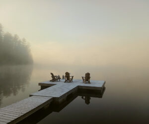 Dock view on a foggy lake