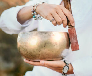 Person using a singing bowl